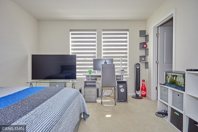 carpeted bedroom with baseboards and multiple windows