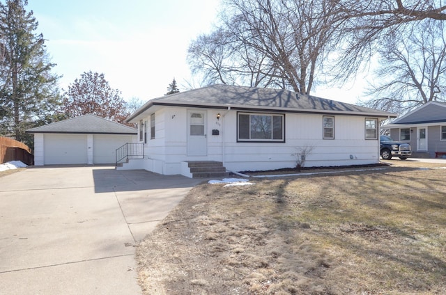 ranch-style house with a garage, entry steps, an outdoor structure, and fence