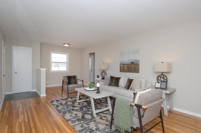 living room with wood finished floors and baseboards