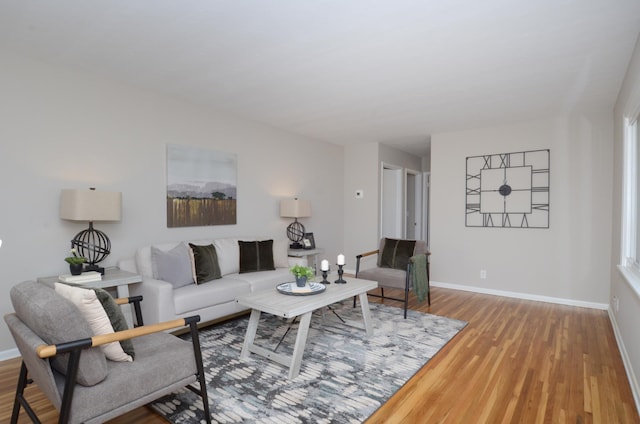 living area featuring wood finished floors and baseboards