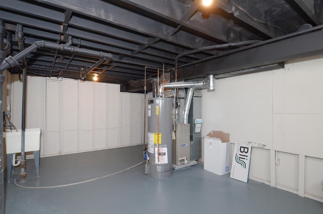 unfinished basement featuring heating unit, water heater, and a sink