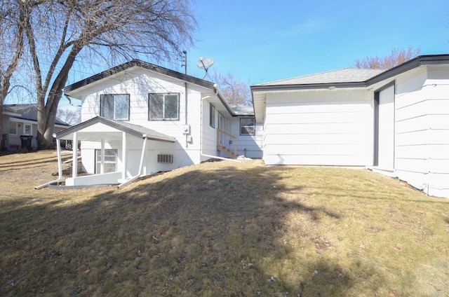 exterior space with crawl space and a yard