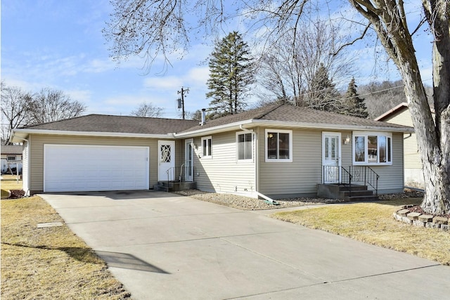 single story home featuring concrete driveway, an attached garage, and a shingled roof