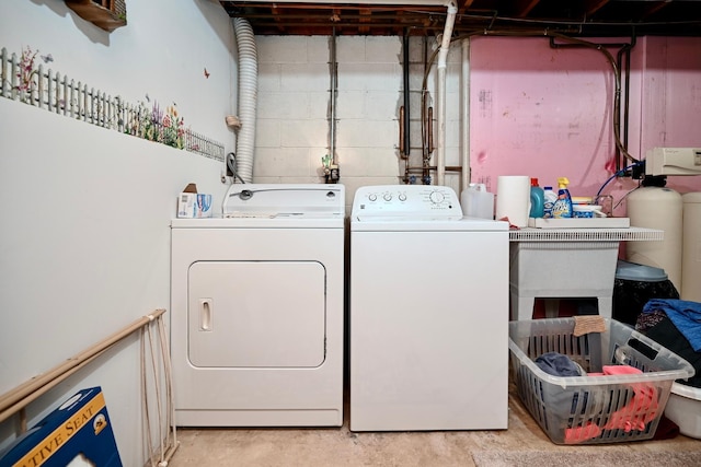 washroom featuring laundry area and washer and clothes dryer