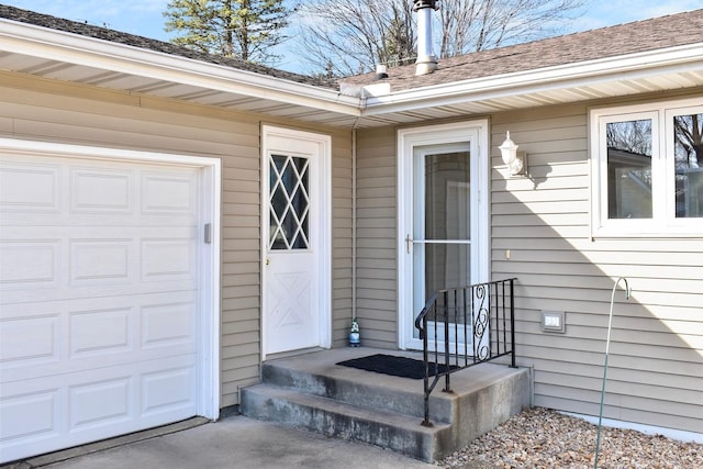 property entrance with an attached garage