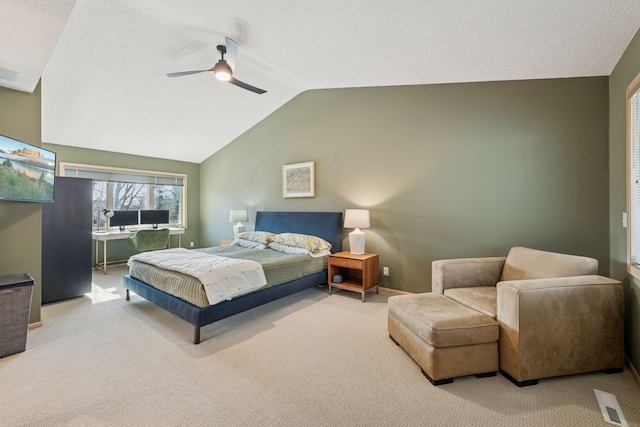 bedroom featuring lofted ceiling, carpet floors, and a ceiling fan