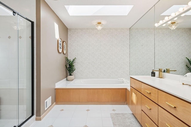 bathroom featuring visible vents, a stall shower, a skylight, tile patterned flooring, and a bath