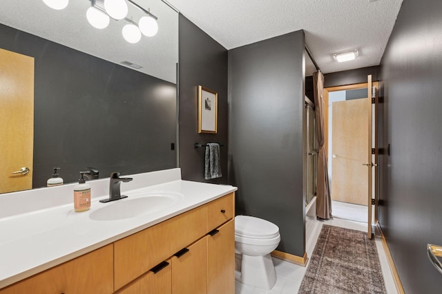 full bath with vanity, visible vents, tile patterned flooring, a textured ceiling, and toilet