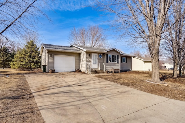 ranch-style home with a garage and concrete driveway