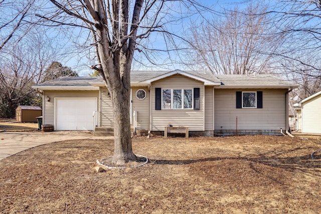 ranch-style house featuring concrete driveway, a storage shed, a garage, and roof with shingles