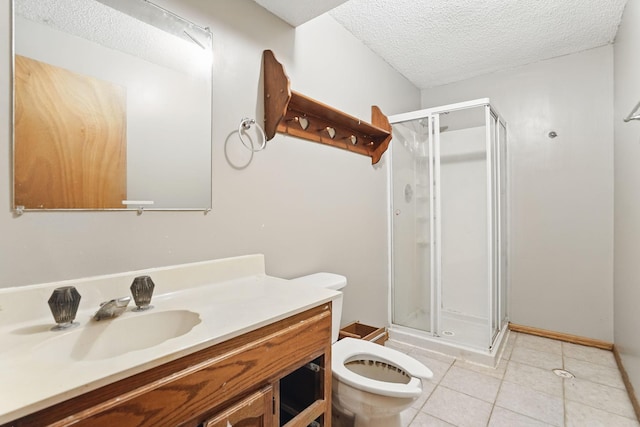 full bathroom featuring tile patterned floors, a stall shower, a textured ceiling, and vanity