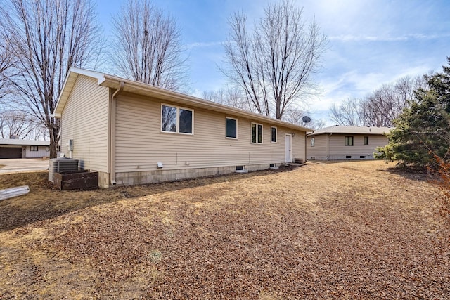 back of property with central AC unit