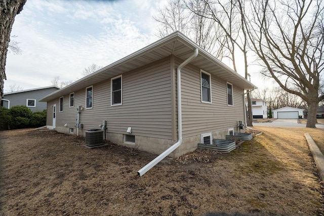 view of home's exterior with central AC