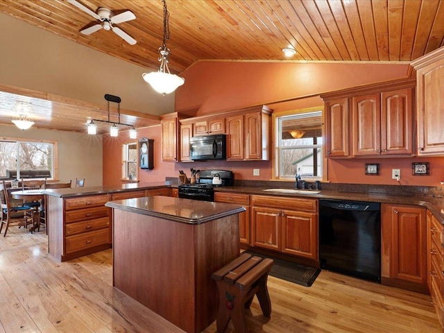 9529- 20th St, Saint Mathias Twp, MN 56449 - kitchen featuring lofted ceiling, a sink, wooden ceiling, black appliances, and a peninsula