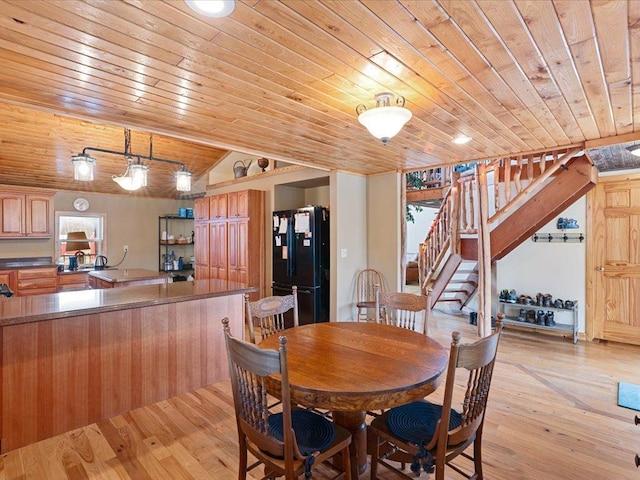 9529- 20th St, Saint Mathias Twp, MN 56449 - dining space with lofted ceiling, stairway, light wood-style flooring, and wooden ceiling