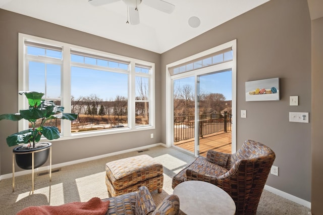 sitting room with visible vents, baseboards, and carpet