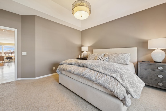 carpeted bedroom with baseboards