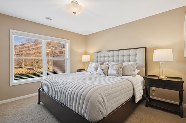 carpeted bedroom with baseboards