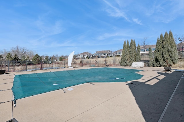 view of swimming pool featuring a fenced in pool, a patio area, and fence