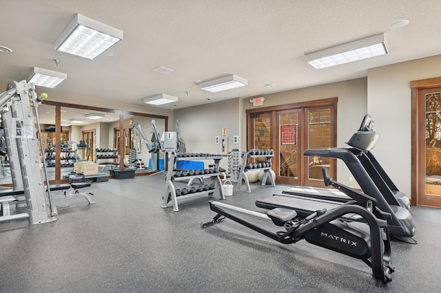 gym with a textured ceiling