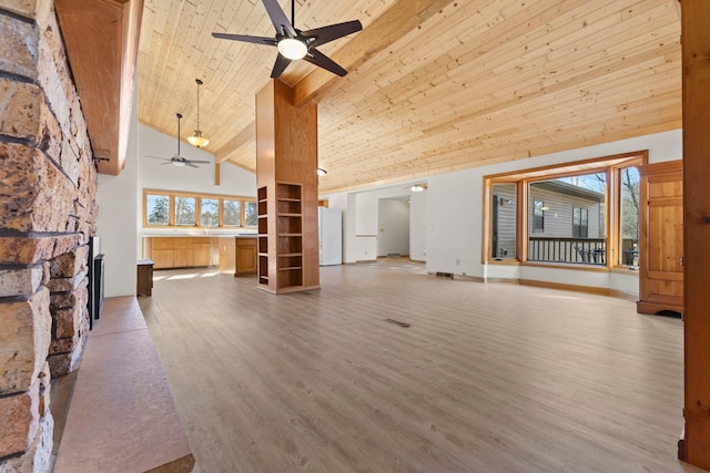 unfurnished living room with wood ceiling, a stone fireplace, light wood-style floors, high vaulted ceiling, and a ceiling fan