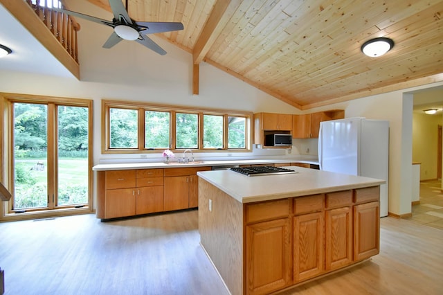 kitchen featuring light countertops, plenty of natural light, wooden ceiling, and appliances with stainless steel finishes