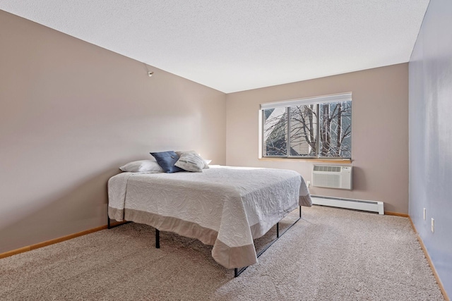 bedroom featuring a wall mounted air conditioner, baseboards, baseboard heating, and carpet flooring