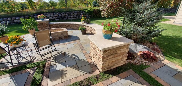 view of patio / terrace featuring a fire pit