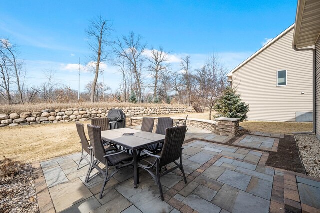 view of patio featuring outdoor dining area