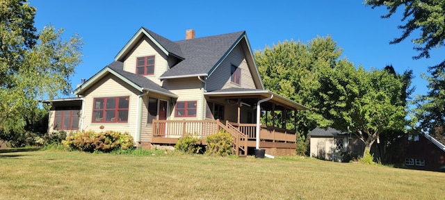 17634 240th St, Hutchinson Twp, MN 55350 - view of front of property with a front lawn, a shingled roof, a chimney, and a deck