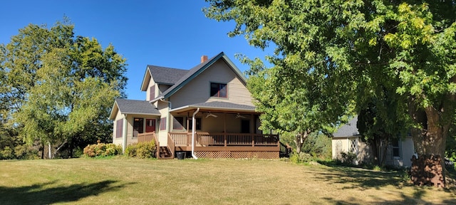 17634 240th St, Hutchinson Twp, MN 55350 - back of house featuring ceiling fan, a yard, a wooden deck, and a chimney