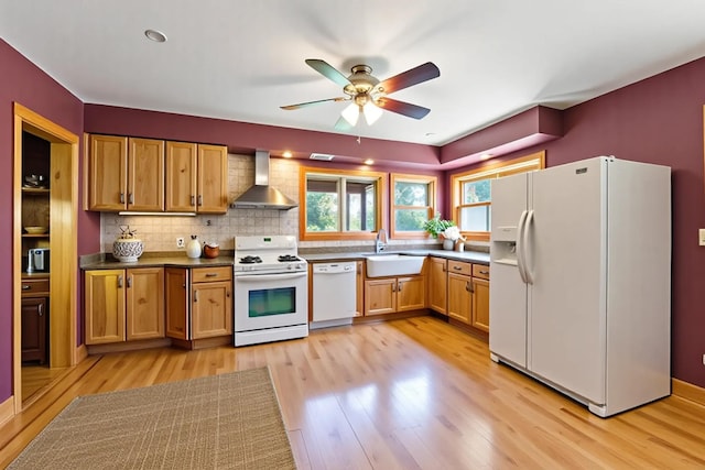 17634 240th St, Hutchinson Twp, MN 55350 - kitchen with white appliances, wall chimney exhaust hood, light wood-type flooring, a ceiling fan, and dark countertops