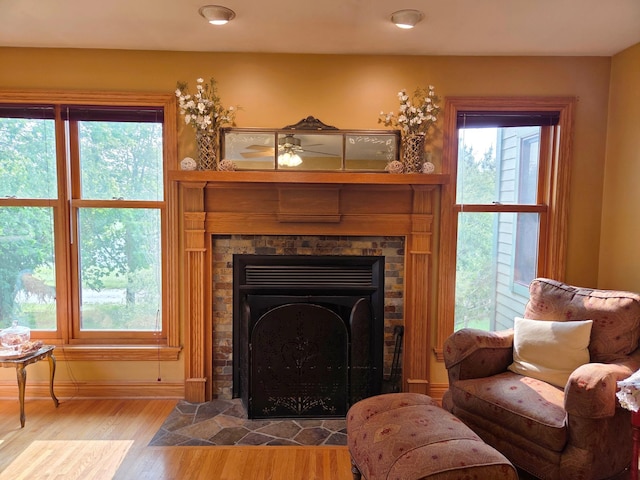 17634 240th St, Hutchinson Twp, MN 55350 - living room featuring a tile fireplace, wood finished floors, and recessed lighting