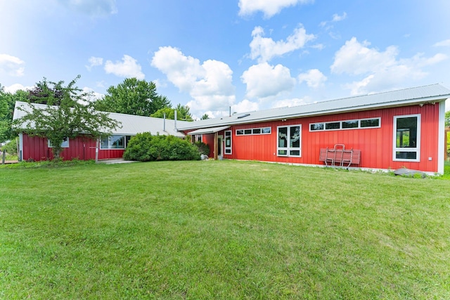 17634 240th St, Hutchinson Twp, MN 55350 - rear view of property featuring a yard, board and batten siding, and a metal roof