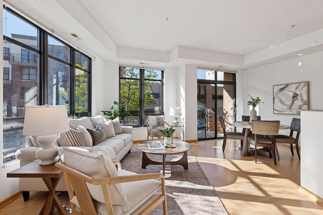 living room featuring wood finished floors and visible vents