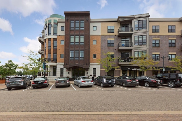 view of property featuring uncovered parking