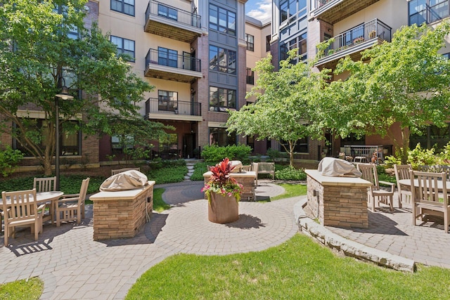 view of home's community with a patio area