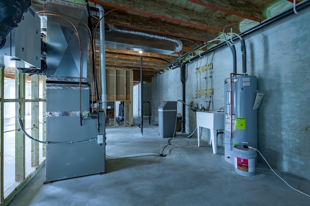 unfinished basement featuring water heater, heating unit, and a sink