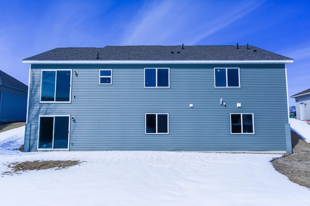 view of snow covered house