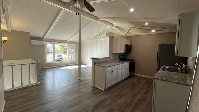 kitchen with range with electric cooktop, an AC wall unit, a sink, dark wood finished floors, and black microwave