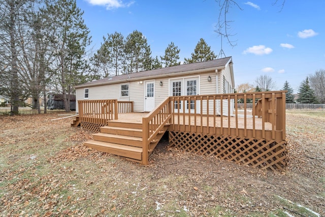 back of property featuring a wooden deck