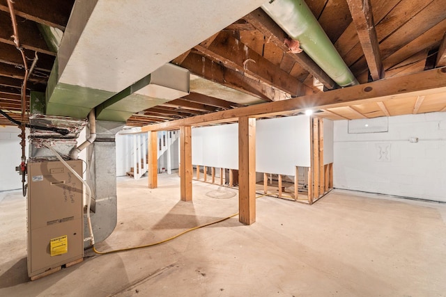 unfinished basement with heating unit