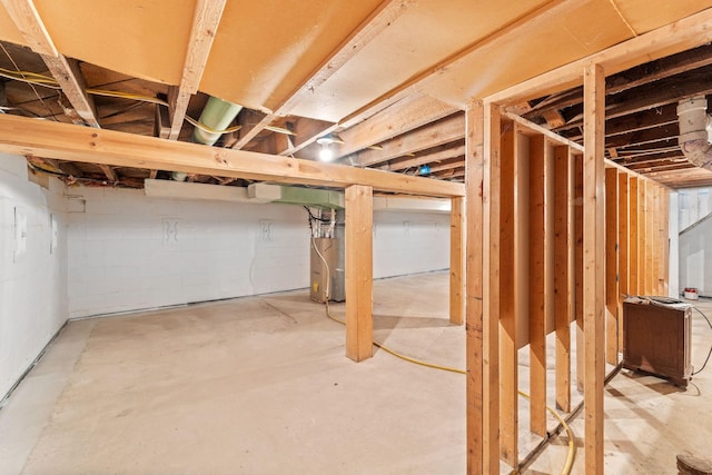 unfinished basement with water heater