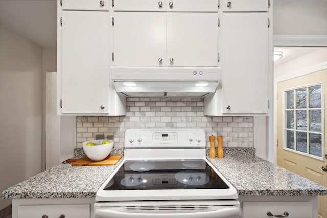 kitchen with white electric stove, backsplash, under cabinet range hood, and white cabinetry