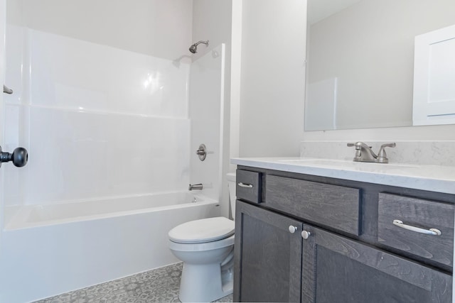 bathroom with bathtub / shower combination, toilet, and vanity