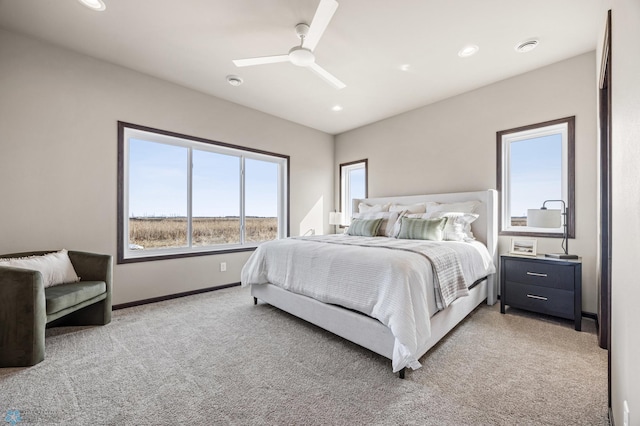 bedroom with recessed lighting, baseboards, light carpet, and ceiling fan