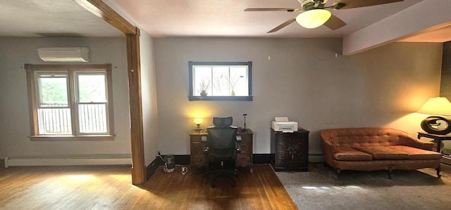 home office with a wall unit AC, wood finished floors, and a baseboard radiator