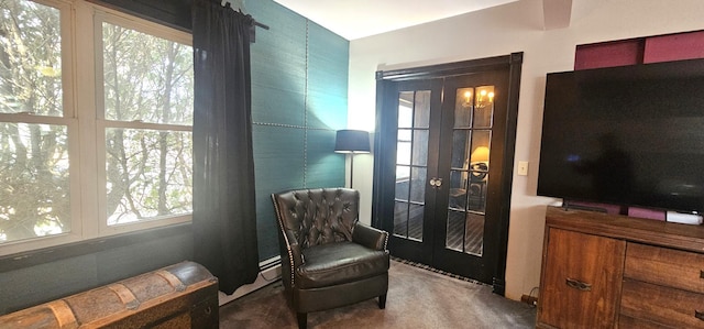 sitting room with french doors and carpet flooring