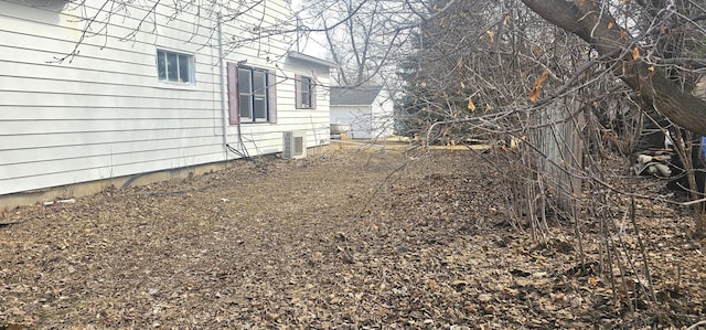 view of yard featuring central AC unit