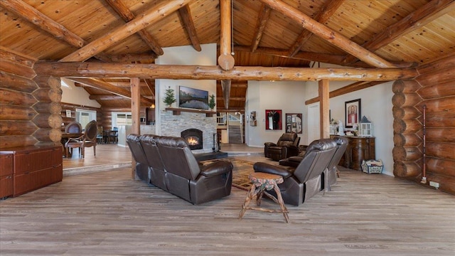 living room featuring a fireplace, wooden ceiling, and wood finished floors